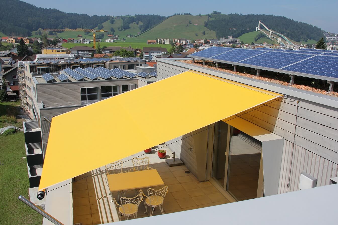 Yellow retractable sail patio cover