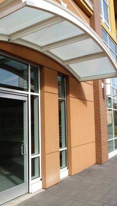 White door canopy on a commercial building