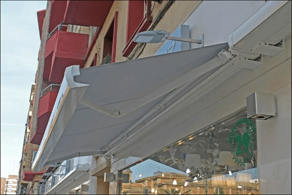 full cassette retractable awning attached to building