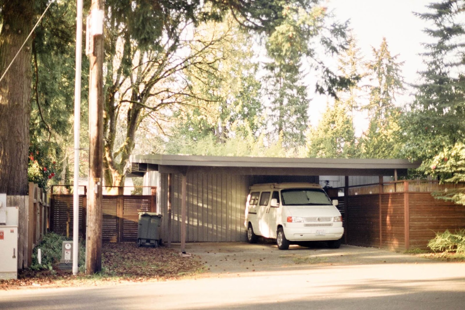 Awning on a home protecting a van