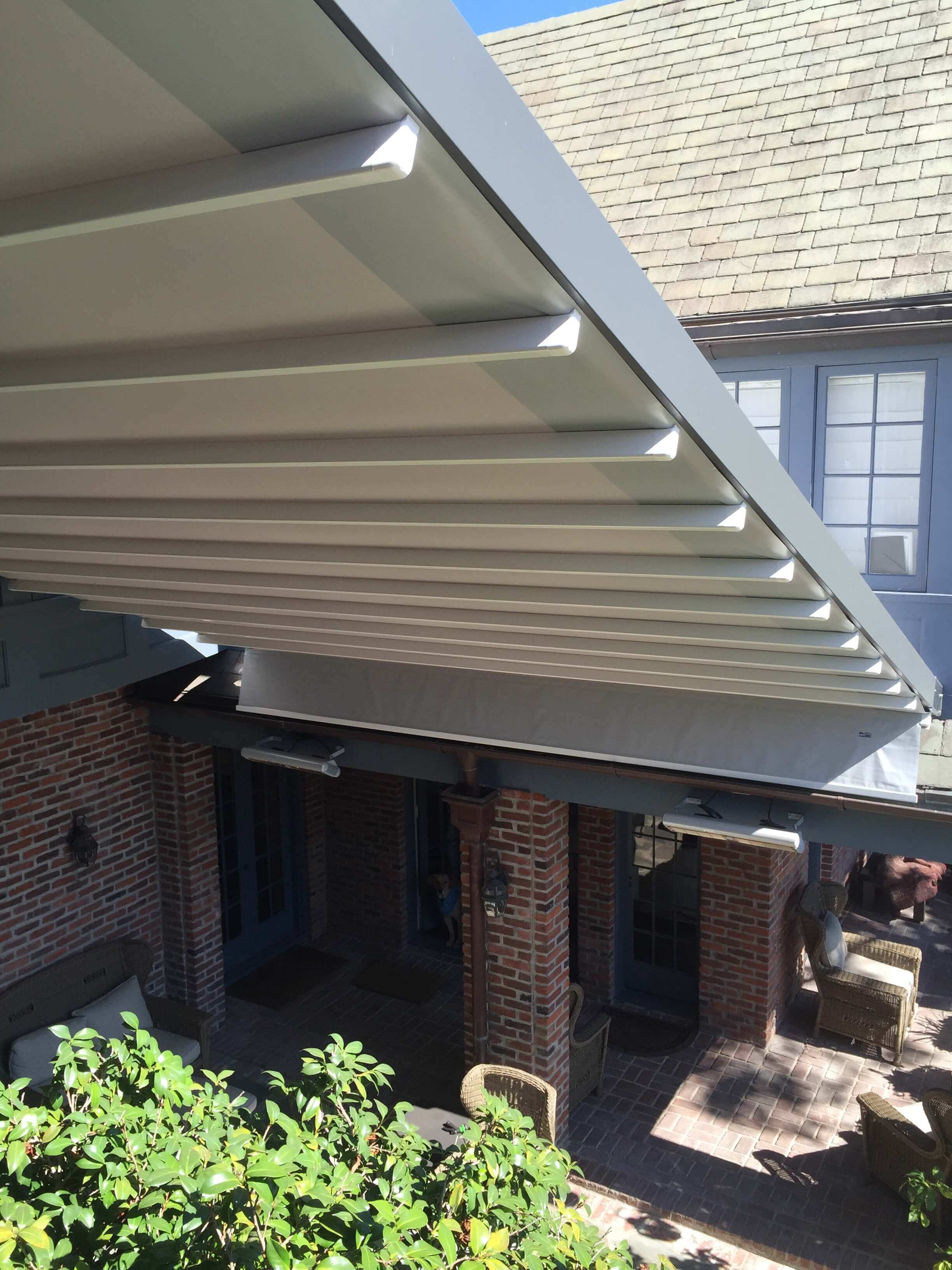 Retractable waterproof wall to wall patio deck cover system