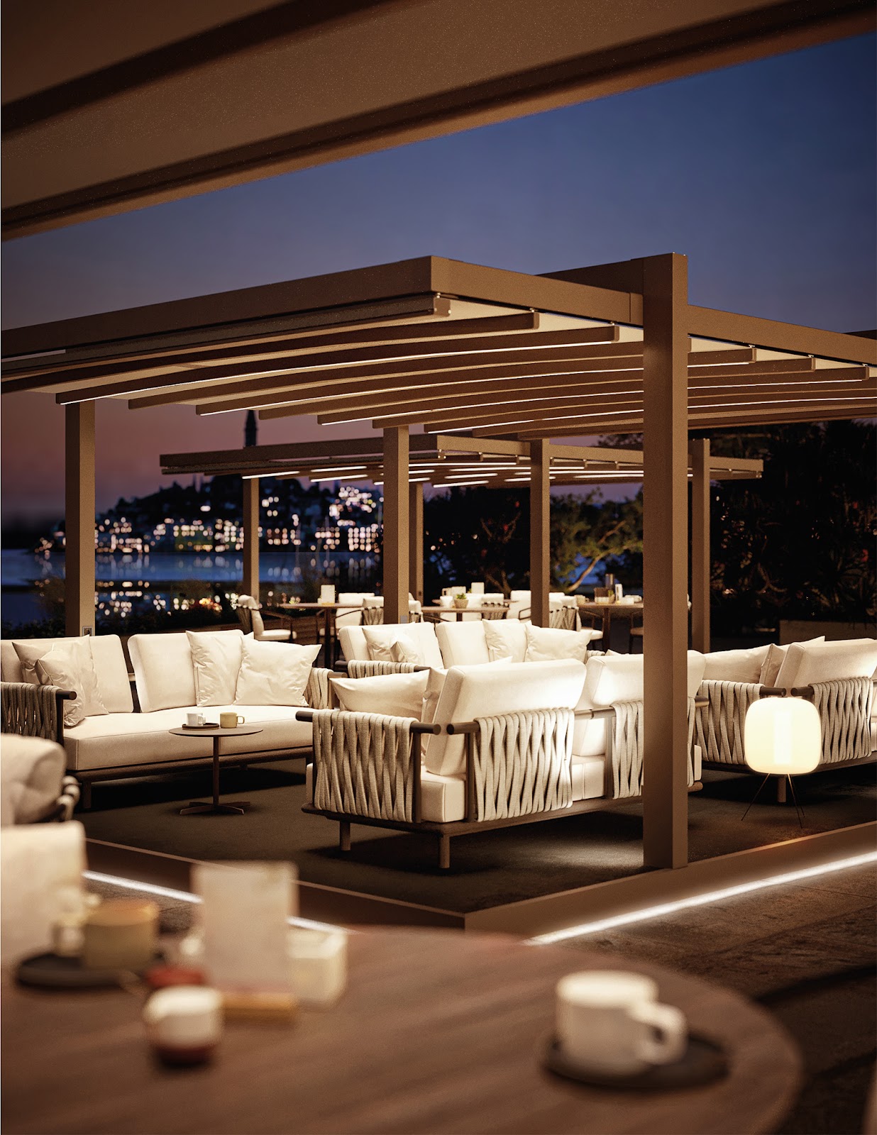 Free standing awnings over patio furniture at night