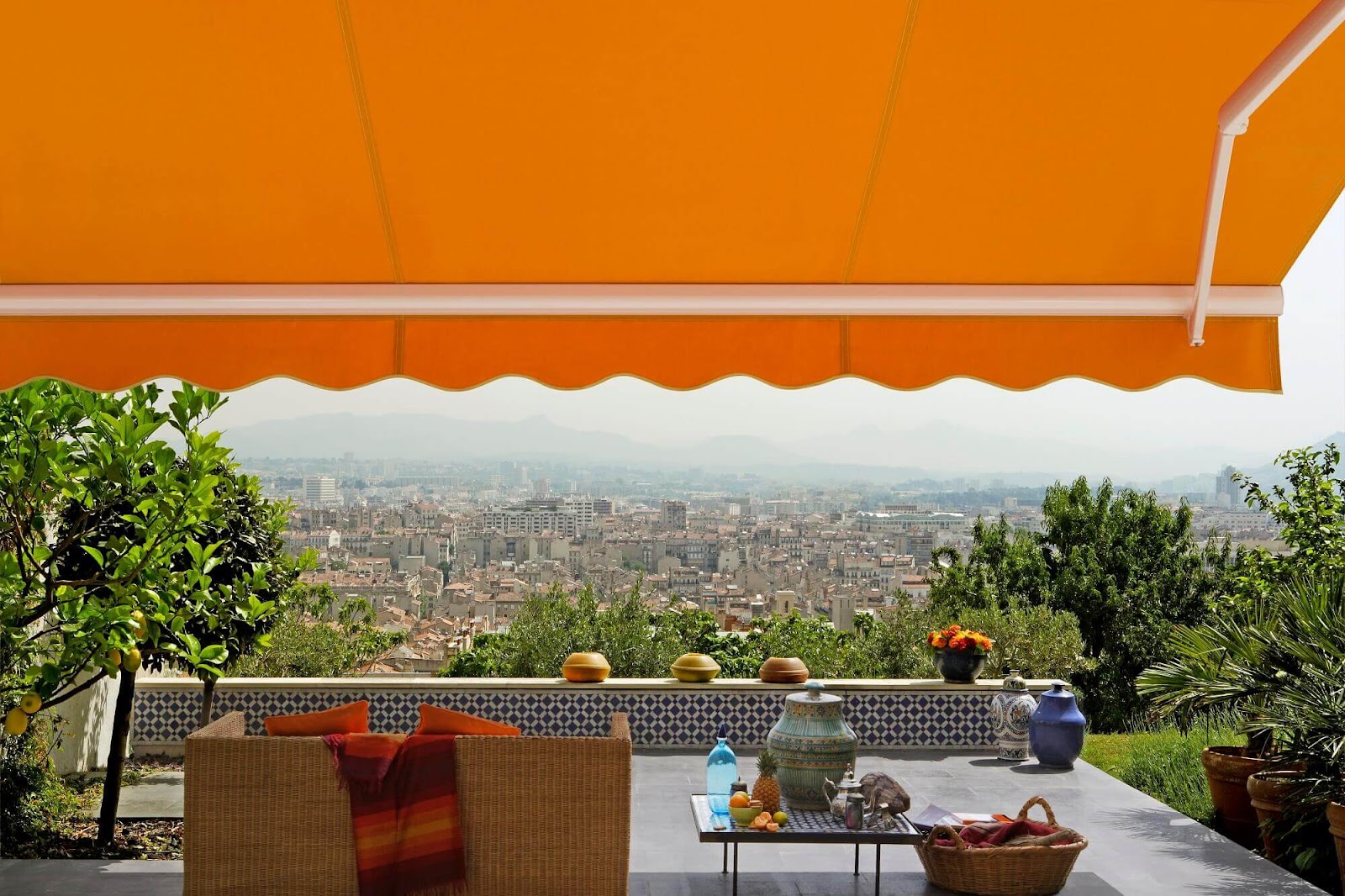 Orange collapsible retractable canopy on a patio