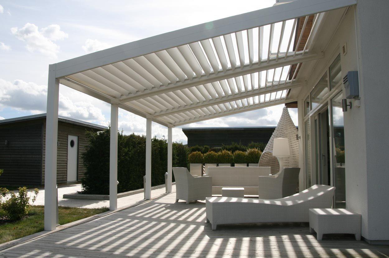 White furniture under a white rotating louvered roof