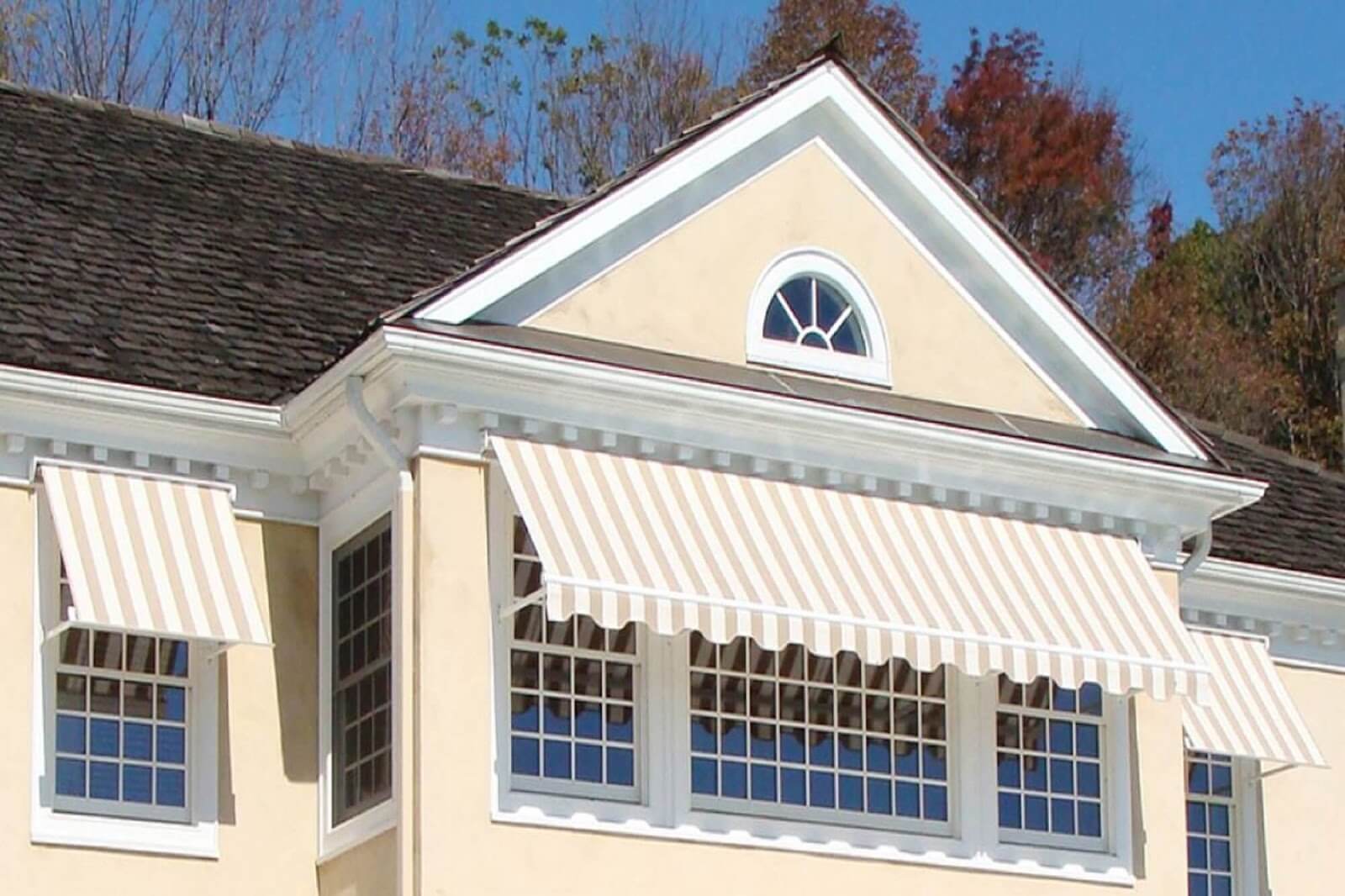 White striped residential retractable window awnings